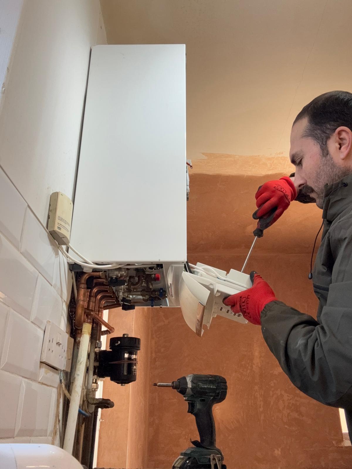 LGHS engineer working on a domestic boiler